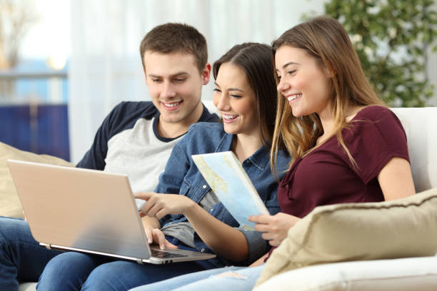 istock Friends planning a trip on line 810556314