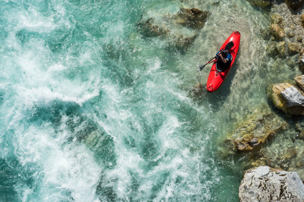 istock Mature Man Kayaking On  River Soca Rapids - High Angle View 810563586