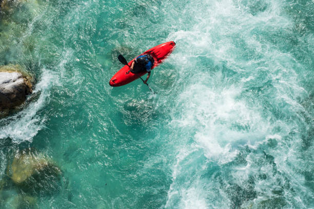 istock Mature Man Kayaking On  River Soca Rapids - High Angle View 810563588