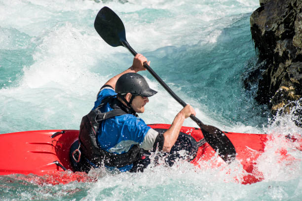istock Close Up Of Mature Man Kayaking On White Water's 810563714