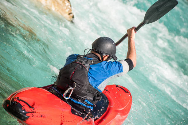 istock Close Up Of Mature Man Kayaking On White Water's 810563782