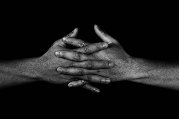 istock hand of man join together on black 810563798