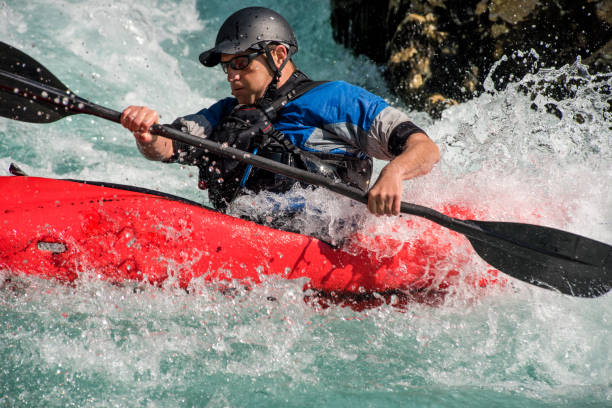 istock Close Up Of Mature Man Kayaking On White Water's 810563818