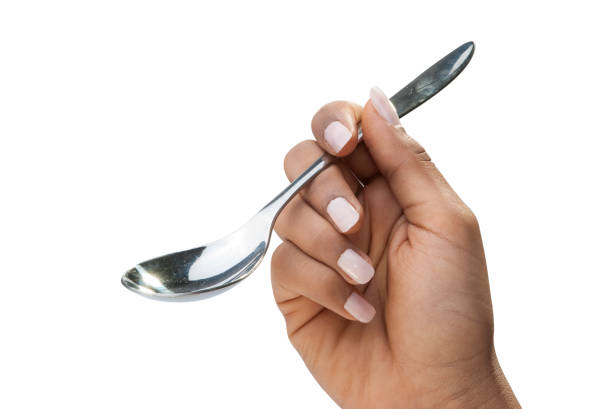 istock Holding spoon for ice cream isolated for advert 810564870