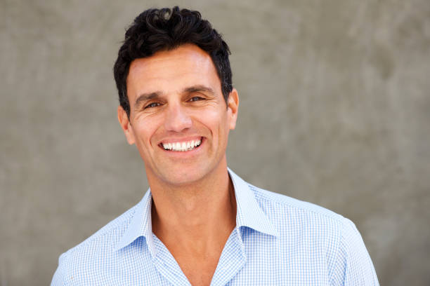 istock Close up handsome casual businessman smiling 810567320