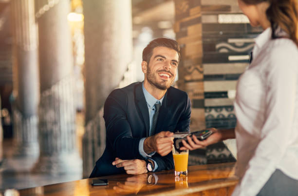 istock Businessman paying via credit card 810578780