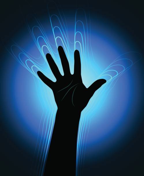 istock The contour of the human hand with the glowing waves leaving it 810579768