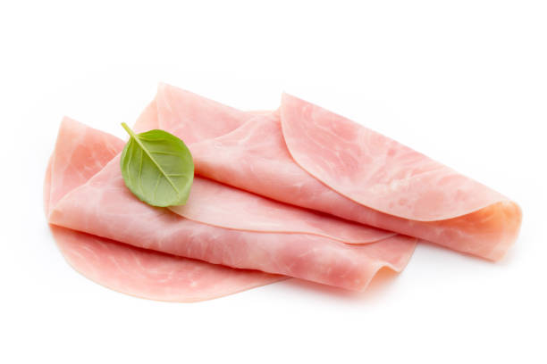 istock Thin slices of ham on white background. 810583416