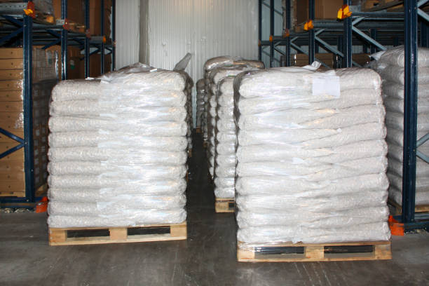 istock Stacks of sacks on pallets in storage room. 810583892