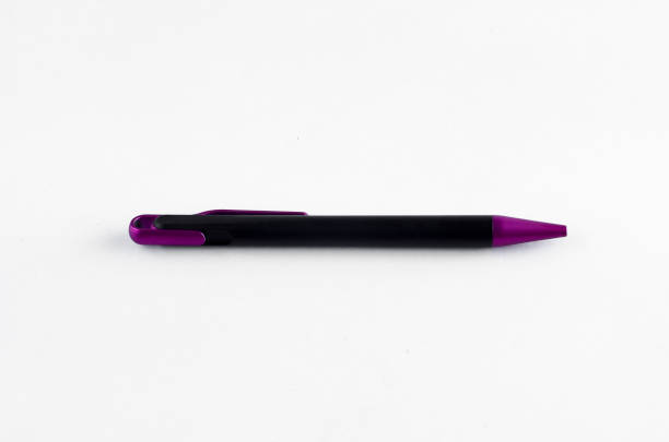 istock Purple and black pen on white background 810587172
