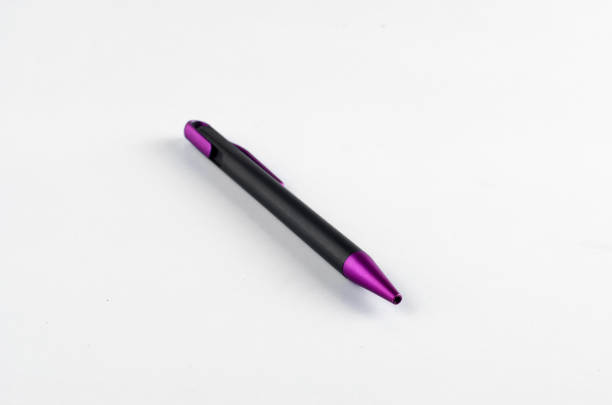 istock Purple and black pen on white background 810599120