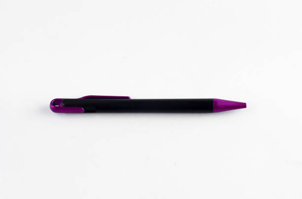 istock Purple and black pen on white background 810599634