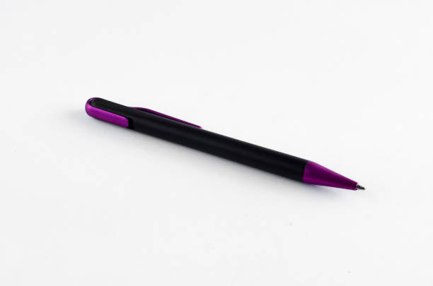 istock Purple and black pen on white background 810603078