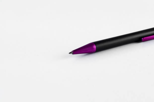 istock Purple and black pen on white background 810603602