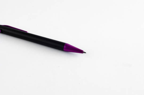 istock Purple and black pen on white background 810613428