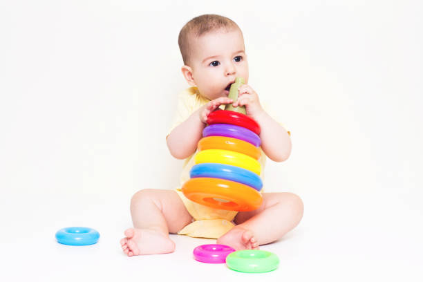 istock Beautiful baby playing with educational colorful toy 810634744