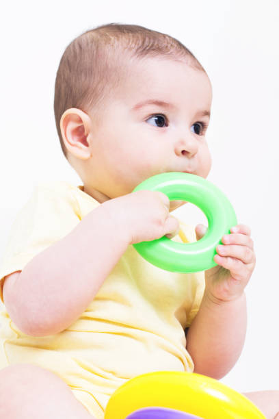 istock Beautiful baby playing with educational colorful toy 810634936