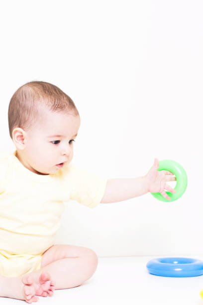 istock Beautiful baby playing with educational colorful toy 810637146