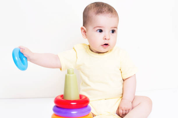istock Beautiful baby playing with educational colorful toy 810641280