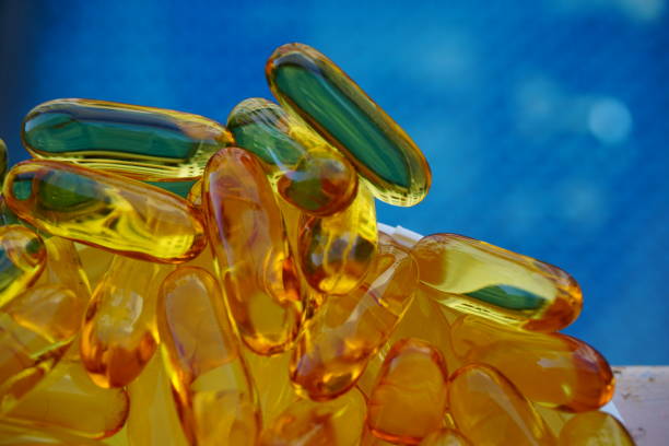 капсула - fish oil coq10 vitamin e cod liver oil стоковые фото и изображения