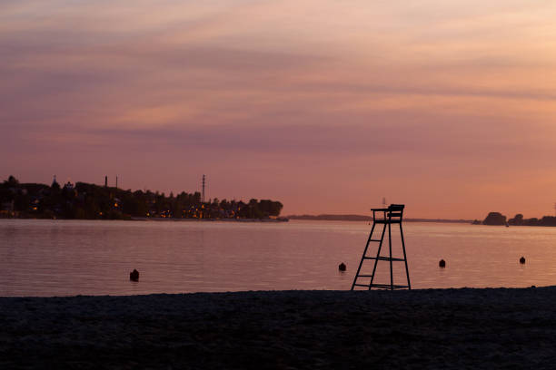 istock Rescue tower on the beach on sunset background 810646988