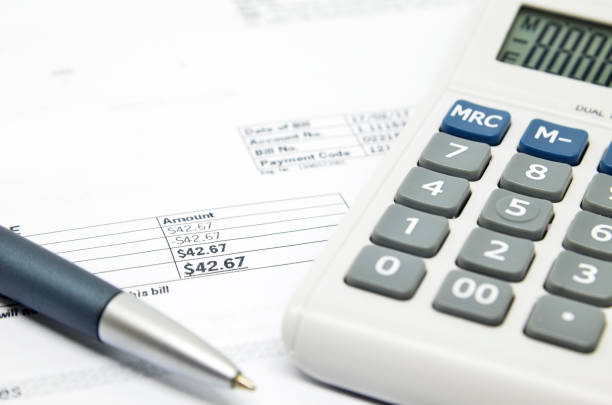 istock Pen on background of calculator and bill 810653384