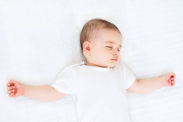 istock Beautiful sleeping baby on white background 810657528