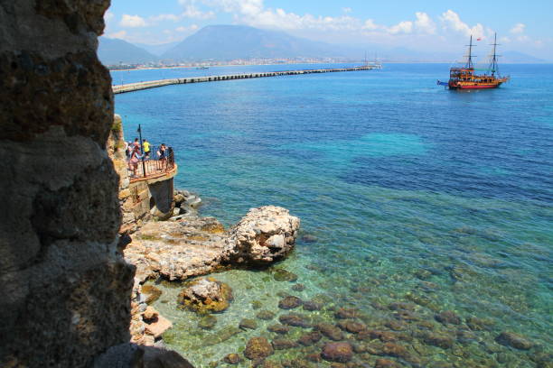 view to the sea near harbour alanya,touristboat in the background