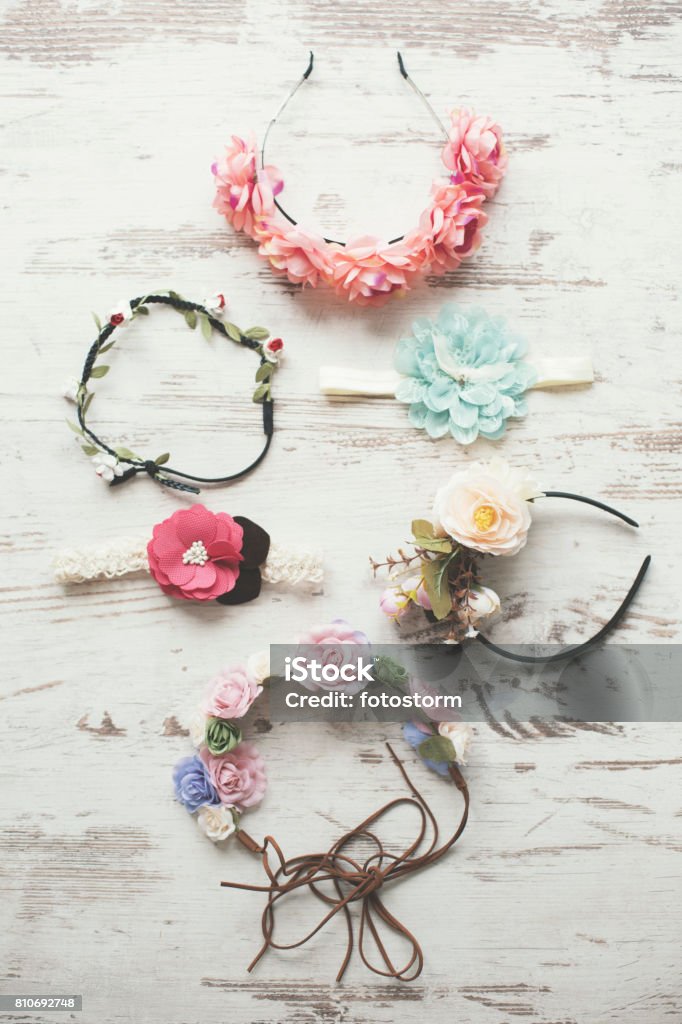 Various floral crowns Various floral crowns on the wooden background. Floral Crown Stock Photo