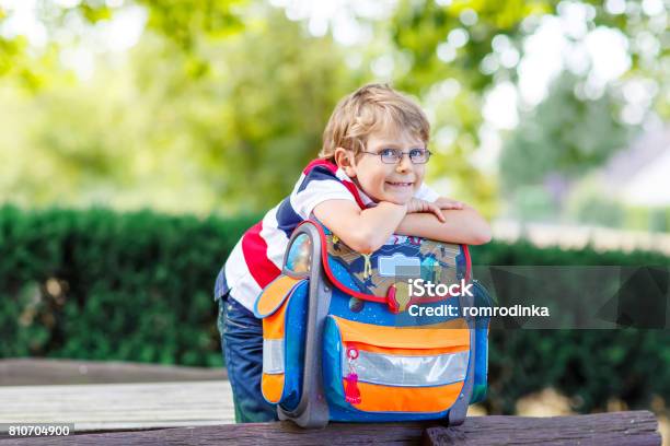 Little Kid Boy With School Satchel On First Day To School Stock Photo - Download Image Now