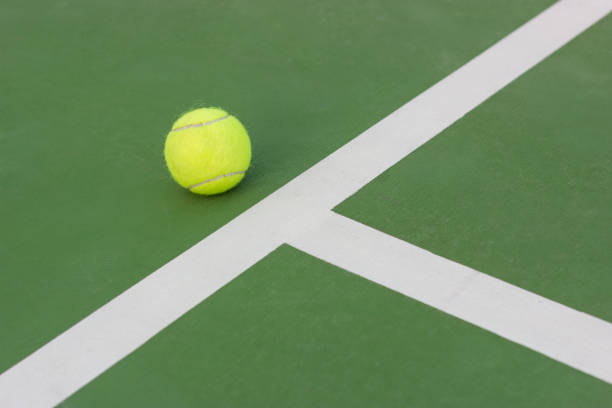 istock Tennis ball on the T-line 810718578