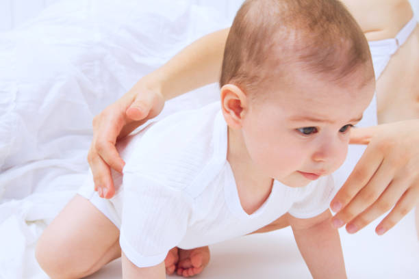 istock Beautiful baby with mother 810721750