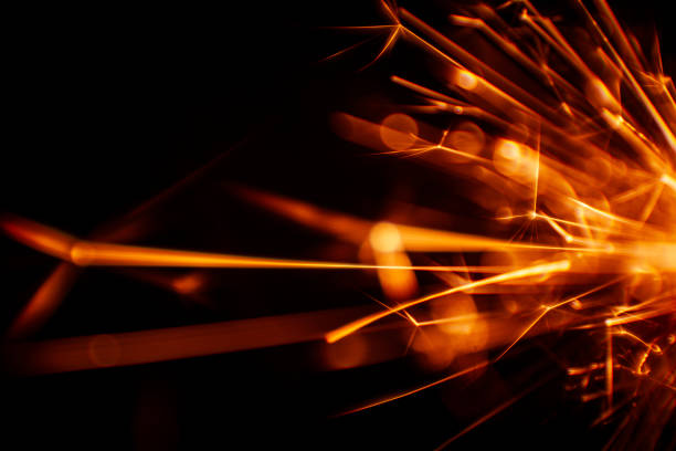 istock Beautiful red sparkler candle. Abstract close-up look. 810736704