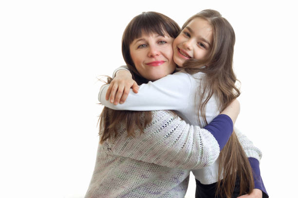 istock mother hugs her little daughter 810757368
