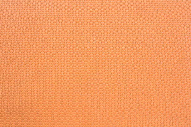 abstrakten turnhalle boden blatt von orange kautschuk hintergrund gemacht. - fashion industry textile man made material green stock-fotos und bilder