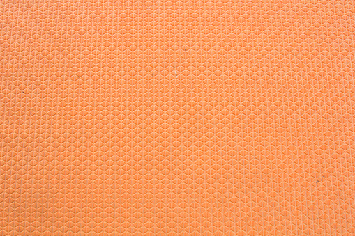 Abstract Gym floor sheet made by orange rubber background.
