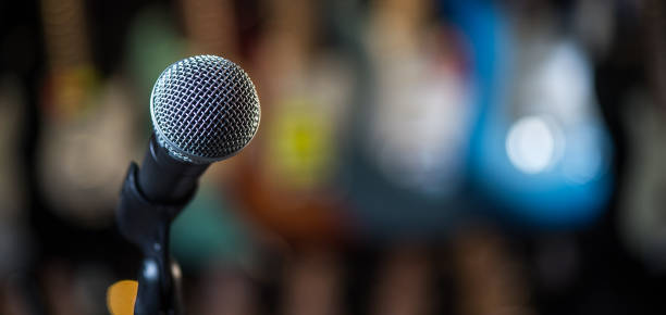 istock Microphone on stage against a background of auditorium 810782656