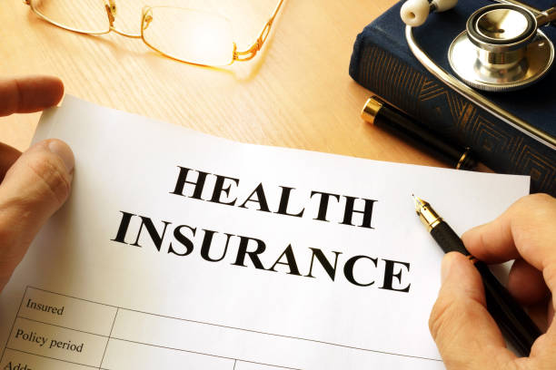 istock Health insurance policy on a table. 810795032