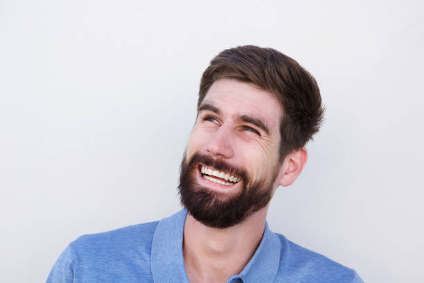 istock Close up smiling confident man with beard looking away and laughing 810797822