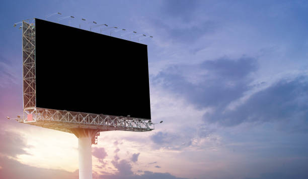 istock Big blank billboard at twilight time for advertisement and present product 810798356