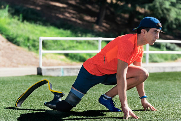 istock Disabled man athlete stretching with leg prosthesis. 810798576