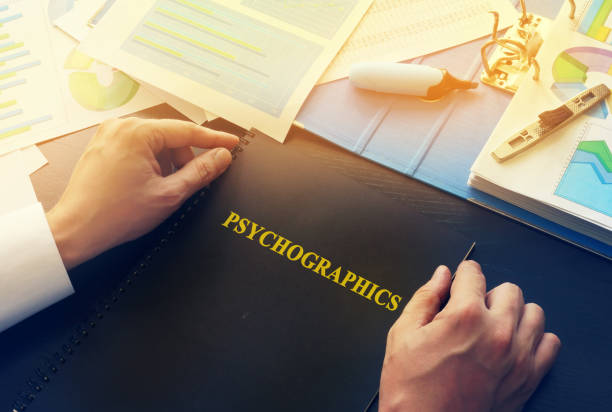 istock Manager taking book with name psychographics. 810798688