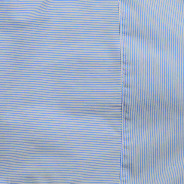 istock Cotton textile material in white and blue stripes for divided background 810808796
