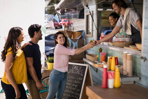 istock Smiling waiter giving order to customer at counter 810850844