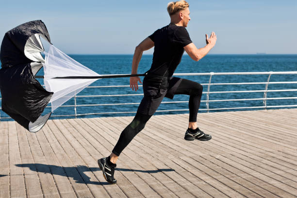 istock Sportsman training with parachute 810868908