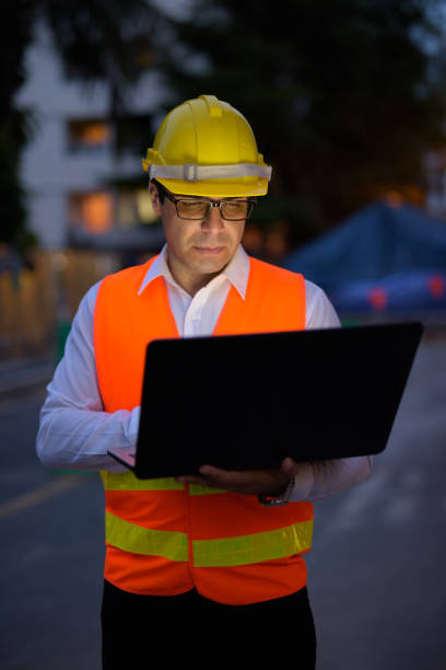 istock Portrait of handsome Persian man construction worker on the construction site at night 810869436