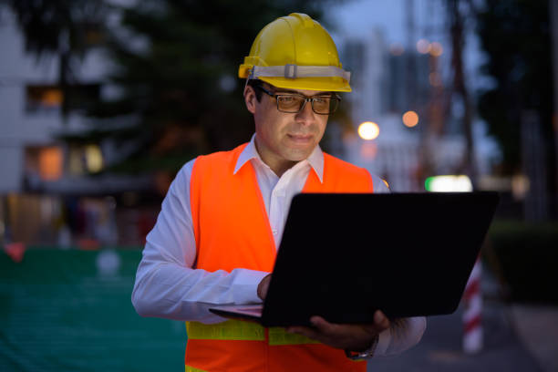 istock Portrait of handsome Persian man construction worker on the construction site at night 810869446