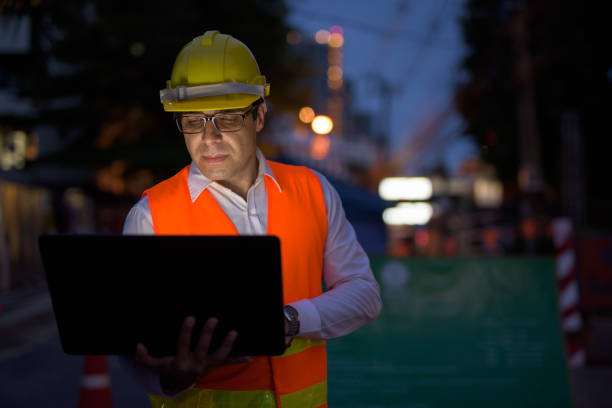 istock Portrait of handsome Persian man construction worker on the construction site at night 810869524
