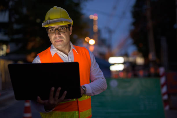 istock Portrait of handsome Persian man construction worker on the construction site at night 810869540