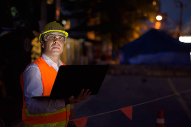 istock Portrait of handsome Persian man construction worker on the construction site at night 810869594
